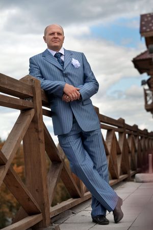 Portrait of a serious groom on the blurred background. Focus point on the groom's face.の写真素材