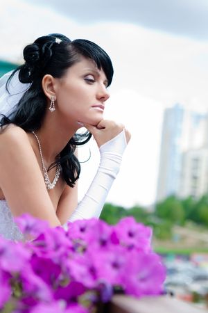 Dreamong bride. Blurred flowers on the foreground.の写真素材