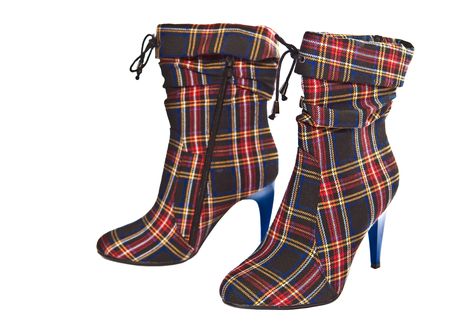 Modern women's boots made from fabric. Isolated on white.の写真素材