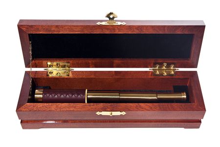 Retro-styled golden spyglass in the wooden box. Isolated on white.の写真素材