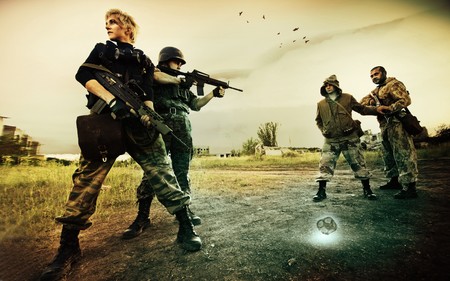 Military patrol in Chernobyl (man and blond woman) is stopping two stalkers on the road の写真素材