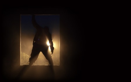 The silhouette of the fat spooky zombie in the doorway.の写真素材