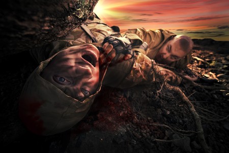 Bloody monster near soldier's dead body. Apocalypse backgroundの写真素材