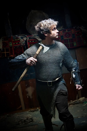 Running medieval warrior in the chain armour with the axeの写真素材