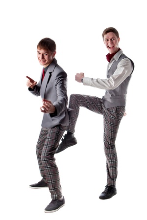 Funny posing students in checkered pants  Isolated on whiteの写真素材