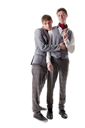 Funnybashful students in checkered pants  Isolated on whiteの写真素材