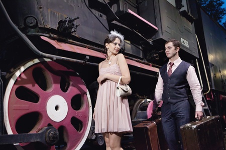 Greeting on the railway station. Vintage locomotive on the background.の写真素材