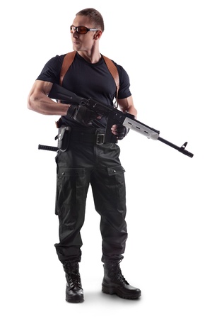 Police officer is holding Kalashnikov. Isolated on white.の写真素材