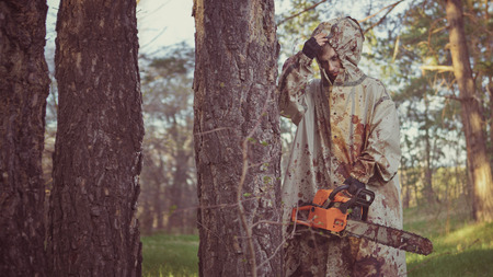 Walking maniac with the chainsaw dressed in a dirty bloody raincoat.
