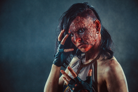 Portrait of Zombie woman with the blood on the face and hands.の写真素材