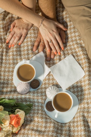 Composition of two cups of coffee and handsの写真素材