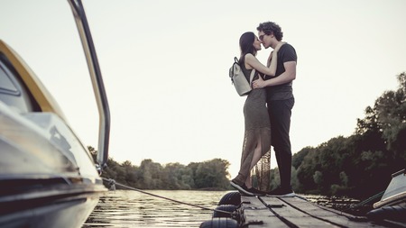 Romantic Couple kissing on the pier.の写真素材