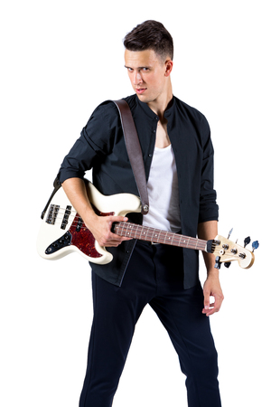 Young musician with guitar, isolated on whiteの写真素材