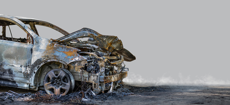 Burnt new car. Isolated on grey background.の写真素材
