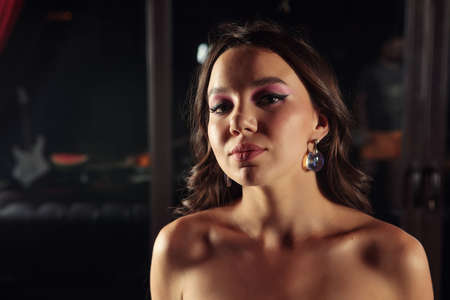 Portrait of a beauty girl on the dark background
