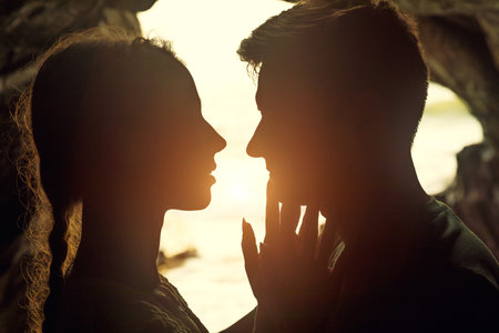 Portrait of happy couple, embracing in the hidden cave at the Querim beach, North Goa, India.の写真素材