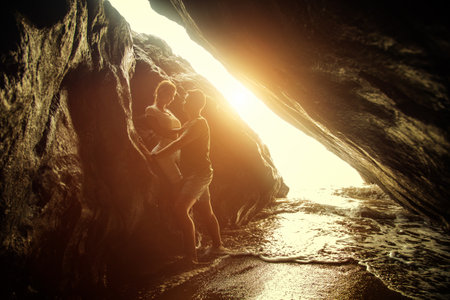 Portrait of happy couple, embracing in the hidden cave at the Querim beach, North Goa, India.の写真素材