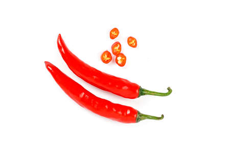 Closeup top view red chili pepper with sliced on white background, raw food ingredient concept