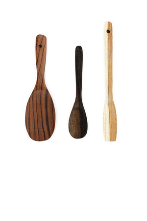 Set of wooden utensils for the kitchen on a white background. Isolated image. Wooden spatulas and cooking spoonsの写真素材
