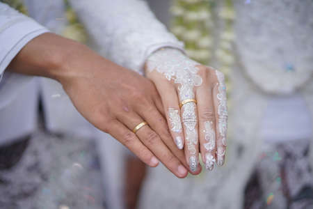traditional wedding, bridal showing henna design and hand jewellery