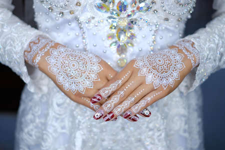 traditional wedding, bridal showing henna design and hand jewellery