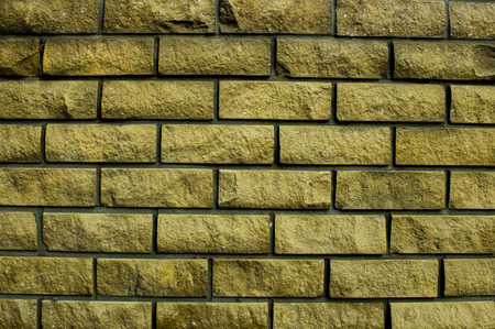 Texture of a beige brick wall.の写真素材