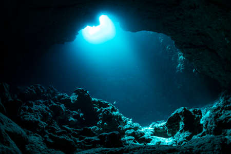 Rays of sunlight into the underwater caveの写真素材