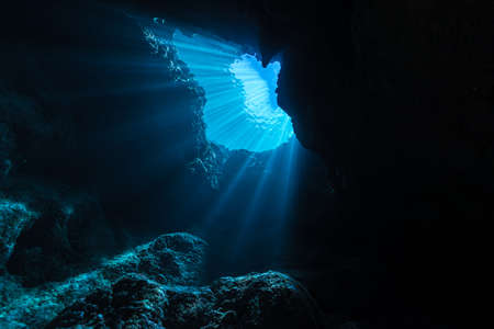 Rays of sunlight into the underwater caveの写真素材
