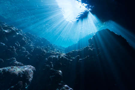 Rays of sunlight into the underwater caveの写真素材