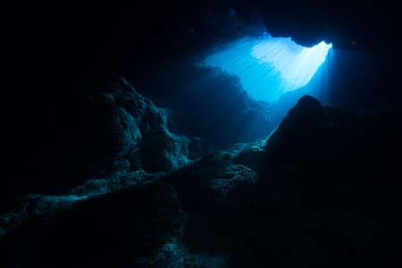 Rays of sunlight into the underwater caveの写真素材