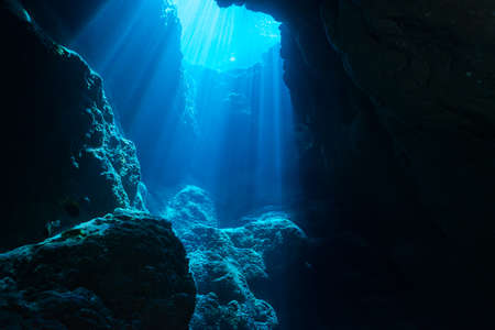 Rays of sunlight into the underwater caveの写真素材