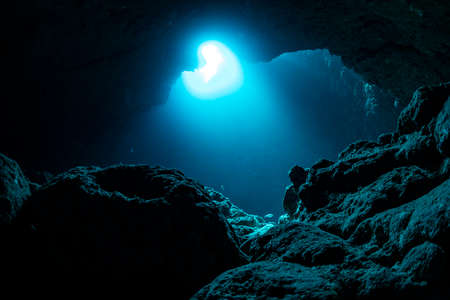 Rays of sunlight into the underwater caveの写真素材