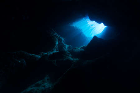 Rays of sunlight into the underwater caveの写真素材