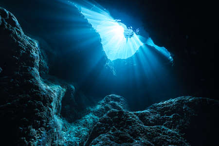 Rays of sunlight into the underwater caveの写真素材