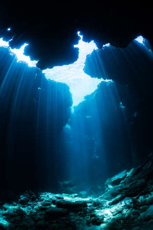 Rays of sunlight into the underwater caveの写真素材
