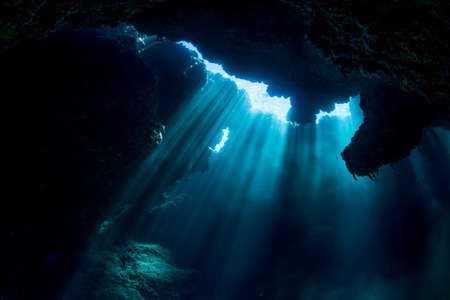 Rays of sunlight into the underwater caveの写真素材