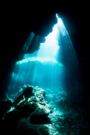 Rays of sunlight into the underwater caveの写真素材