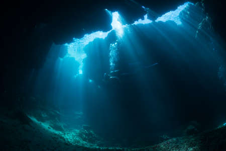 Rays of sunlight into the underwater caveの写真素材