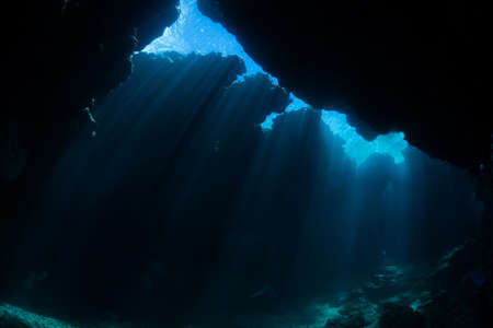 Rays of sunlight into the underwater caveの写真素材