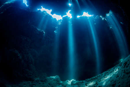 Rays of sunlight into the underwater caveの写真素材