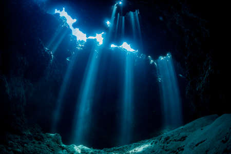 Rays of sunlight into the underwater caveの写真素材