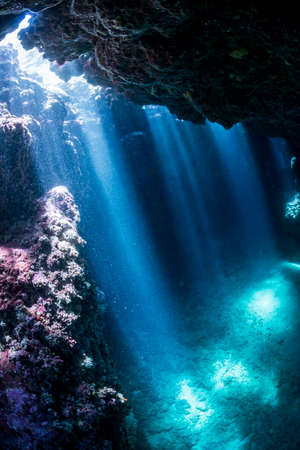 Rays of sunlight into the underwater caveの写真素材