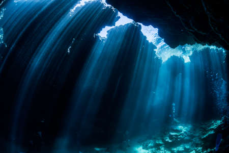 Rays of sunlight into the underwater caveの写真素材