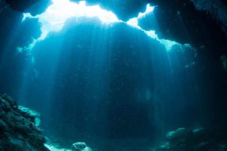 Rays of sunlight into the underwater caveの写真素材