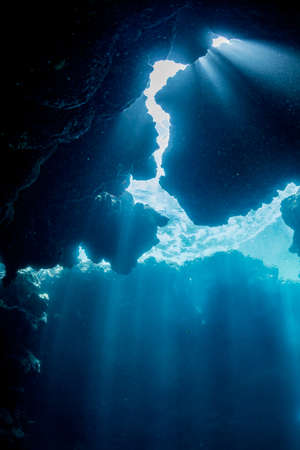 Rays of sunlight into the underwater caveの写真素材