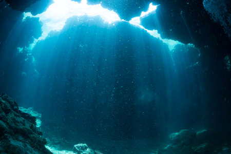 Rays of sunlight into the underwater caveの写真素材