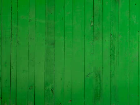 Background and texture. Wooden fence painted with green paint. Copy space.の写真素材