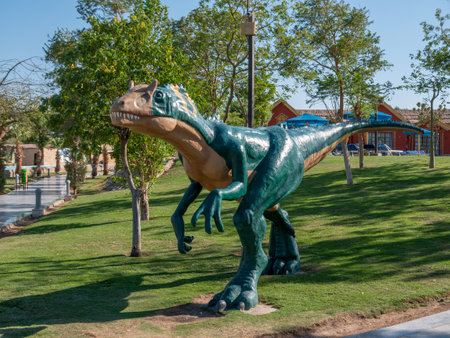 Realistic dinosaur model in the dinosaur park. Dinosaur showing his toothy mouth.のeditorial素材