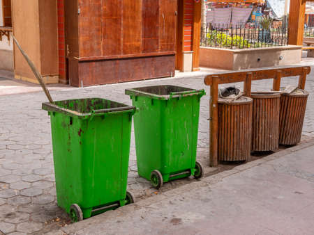 Garbage bins and garbage collection containers on city streets.の写真素材