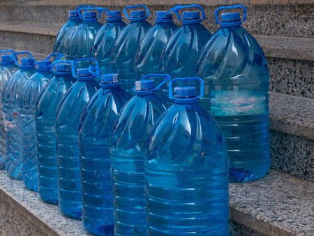 Large plastic bottles of blue color with clean drinking water.の写真素材